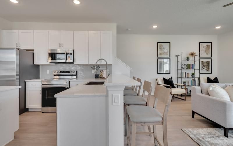 a kitchen with white cabinets