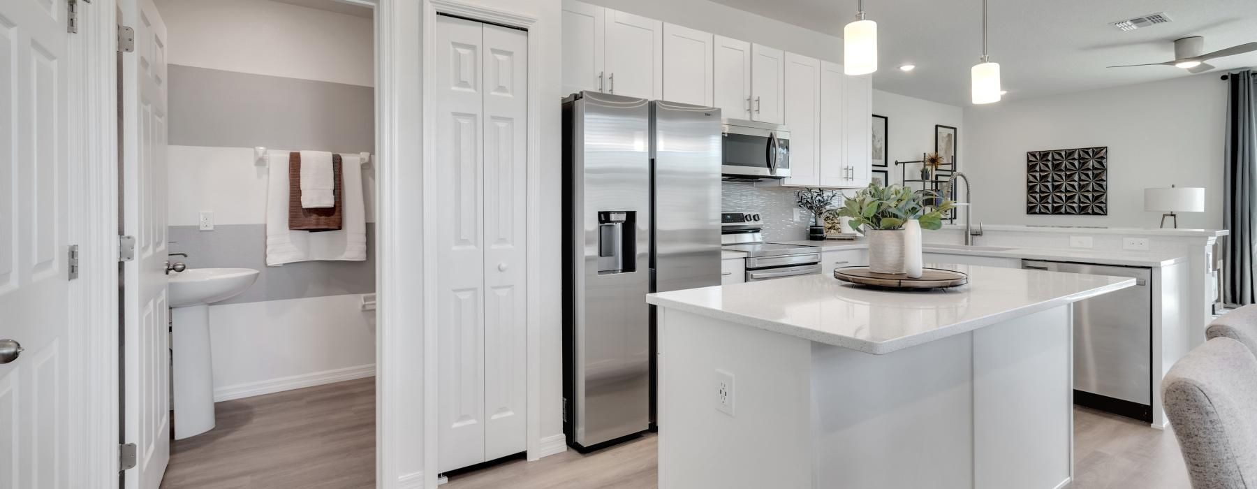 a kitchen with white cabinets