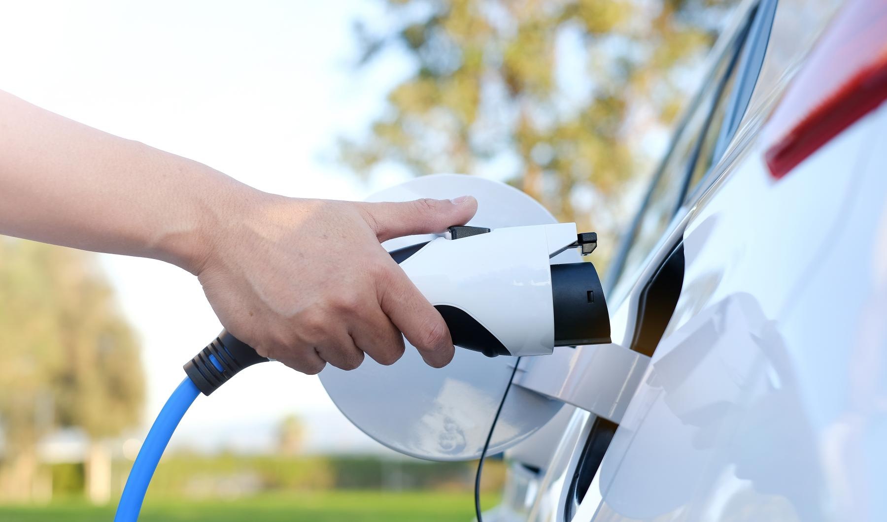 Find your perfect fit at Valencia Isle a person charging a car