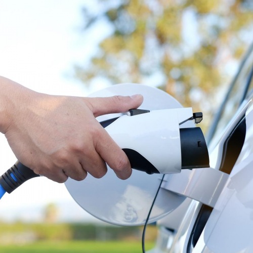 Find your perfect fit at Valencia Isle a person charging a car