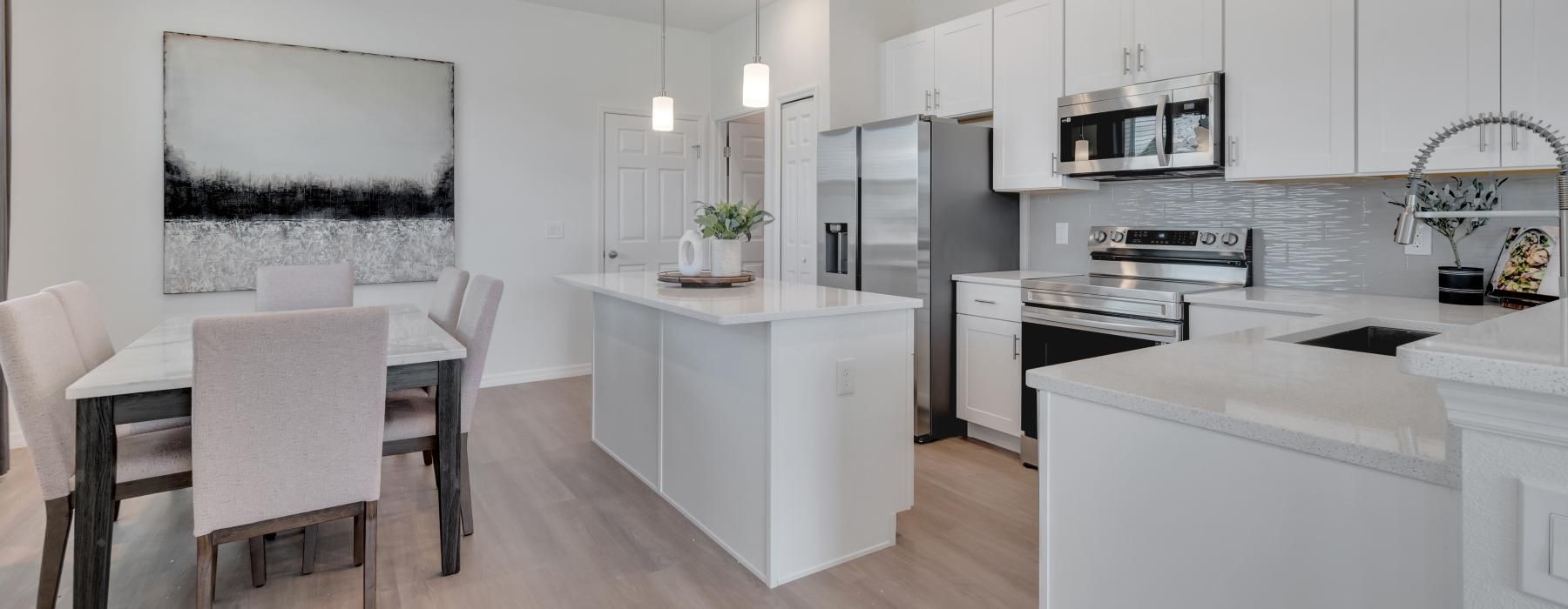 a kitchen with white cabinets